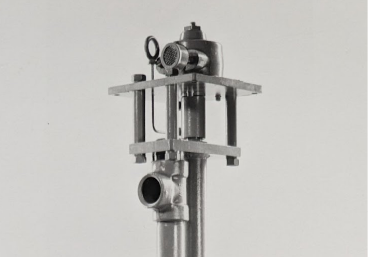 A monochromatic image of a 1 HP Transfer Pump for Zinc and Other Molten Metals against a gray background.